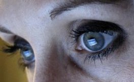 An illustration picture shows a woman looking at the Facebook website on a computer in Munich